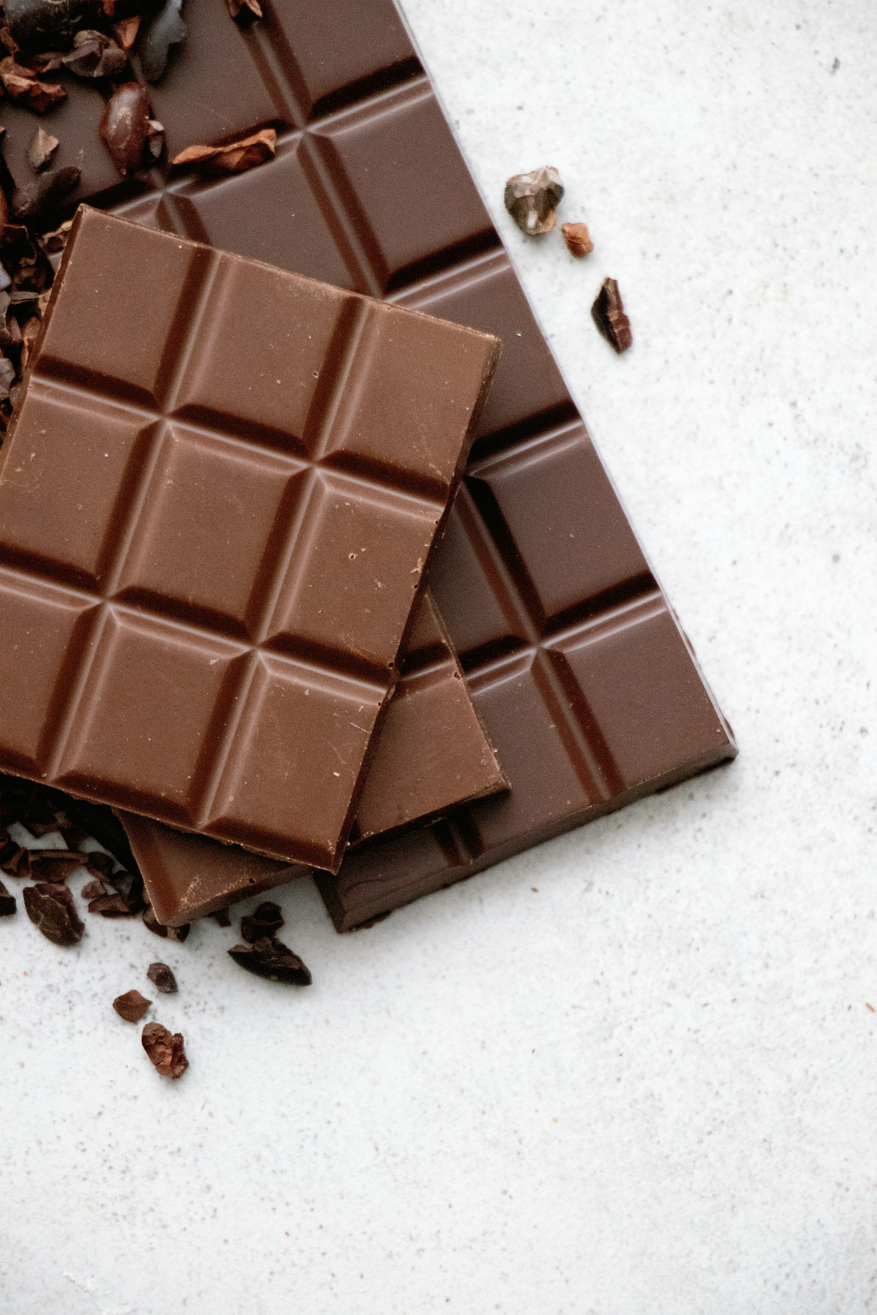 Dark Chocolate Dark Chocolate, Photo by <a href="https://unsplash.com/@tetiana_bykovets?utm_content=creditCopyText&utm_medium=referral&utm_source=unsplash">Tetiana Bykovets</a> on <a href="https://unsplash.com/photos/chocolate-bar-on-white-table-TzN2odwnesg?utm_content=creditCopyText&utm_medium=referral&utm_source=unsplash">Unsplash</a>
